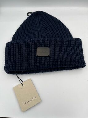 navy blue AllSaints cuffed knit beanie with a leather logo patch